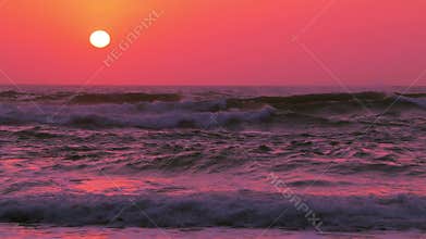 Sunset over Ocean Surf. Slow Motion