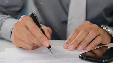 Businessman Signing Document