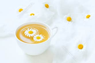 Cup of yellow chamomile tea organic aromatic