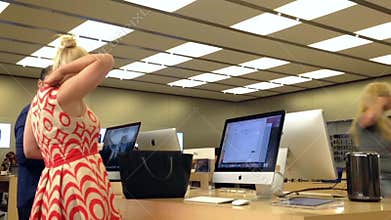 Motion of people buying new mac book