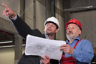 professionals with blueprints