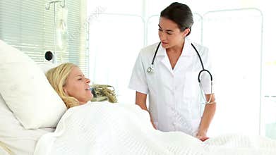 Doctor speaking with her patient