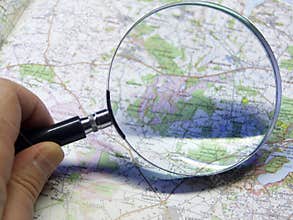 Map and magnifying glas