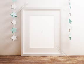 Blank white poster frame at wooden shelf with star nursery theme