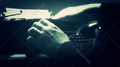 Man typing on a manual typewriter. Vintage 40's style