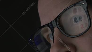 Web shopping reflected in glasses