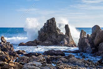 Wave crashing on rocks
