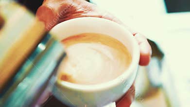 Latte art, Barista make hot latte.