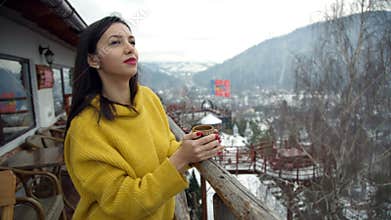 Beautiful young girl enjoy a hot cup of coffee