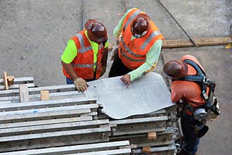 Three Workers With Drawing