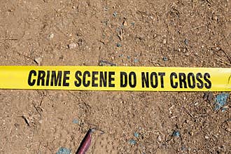 Crime scene do not cross tape on ground