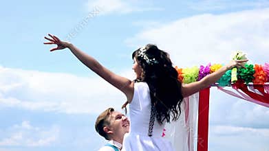 Man and woman, young people, happy married adult couple dancing near wedding arch.