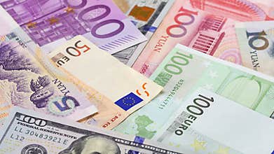 Main word currency Yuan, US Dollar and Euro bank notes rotating