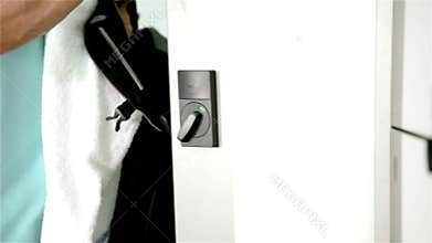 Gym member takes bag from locker