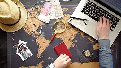 Two young people together planning trip to Europe. Top view.