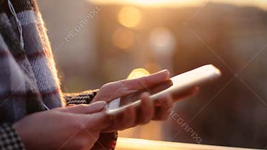 Young woman enjoying her evening listening to music on her cell phone.Part 1 of 2, Edited Sequence