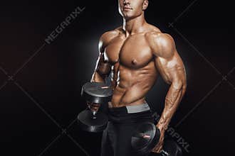 Handsome athletic guy workout with dumbbells