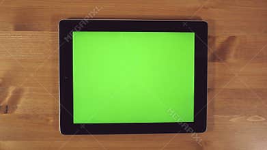 Man Using Tablet PC with Green Screen