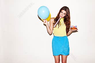 Pretty birthday girl with ballons and cake