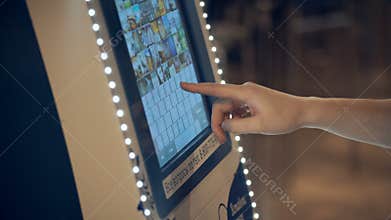 MOSCOW, RUSSIA - FEBRUARY 21, 2016: Hand girl view images on a large touch display. The touch of your fingertips to the