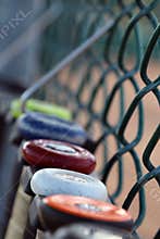 Baseball bat softball bats hanging on a fence