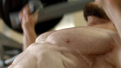 Athlete lifts a heavy weight.