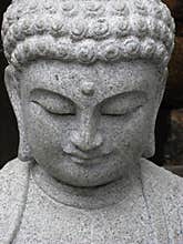 Serene Buddha face looking down