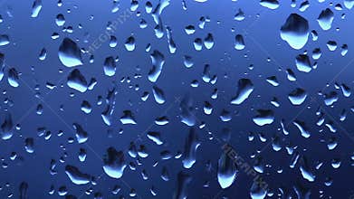 Water drops on a window during winter rain