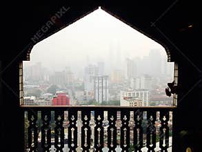 Haze smog pollution over Kuala Lumpur through unique Mosque window