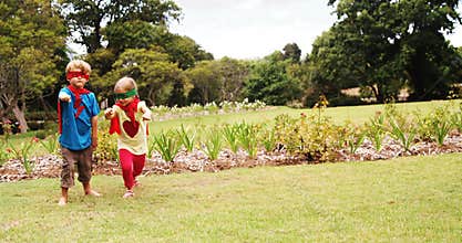 Boy and girl pretending to be a super hero