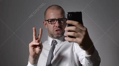 Funny businessman manager makes selfie phone.