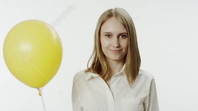 Closeup portrait of smiling woman with balloon