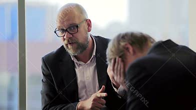 Boss is angry with his subordinate employee in the office and dismissal him
