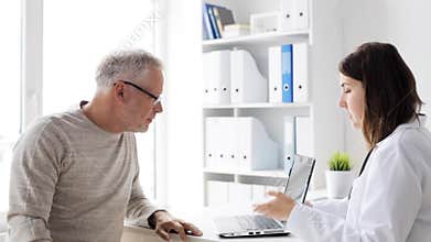 Senior man and doctor with tablet pc at hospital 69