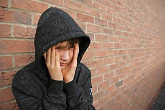 Boy in hooded top
