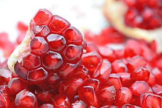 Fresh peeled pomegranates and pomegranate seeds
