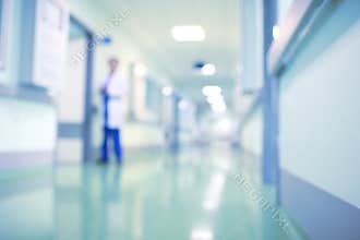 Doctor in hospital corridor, unfocused background