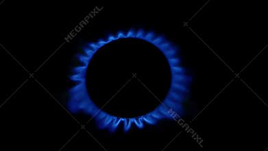 Wind blows on a gas burner. Close up