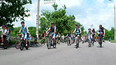 Bike ride through the city, a lot of people, children, teenagers and adults, fans of a healthy lifestyle
