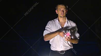 Closeup European Conjurer Shows Card Tricks