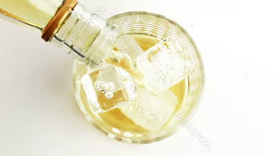 Barman pouring whiskey in the glass on white background, view top