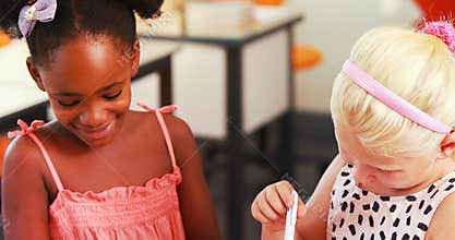 School girls interacting in classroom