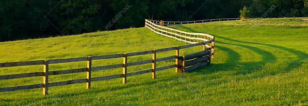 Panoramic Winding Fence In Farm Fields