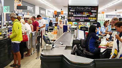 Customers paying for shopping at a supermarket. Line at the cash
