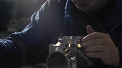 Finished goods quality assurance in mechanical engineering is carried out by the measuring tool. Calipers in hand.