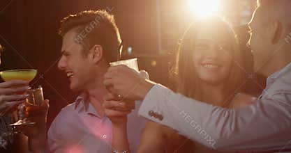 Group of friends toasting cocktail