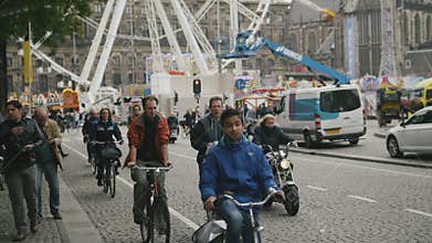 AMSTERDAM, NETHERLANDS - 16 oct 2016, Dam Square - historical center of Holland CAPITAL, tourists, bicycle and cars on