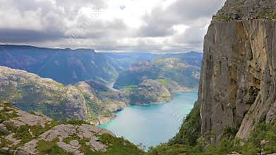Tourists hiking at the Preikestolen cliff in lysefjorden Norway