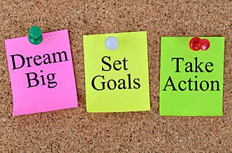 Dream big Set goals Take action written on notes