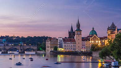 View of the city Prague in Czech Republic with colorful paddle boats day to night timelapse on the Vltava river with